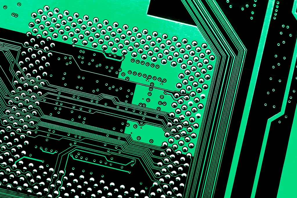 Macro photograph of copper tracks running across a circuit board
