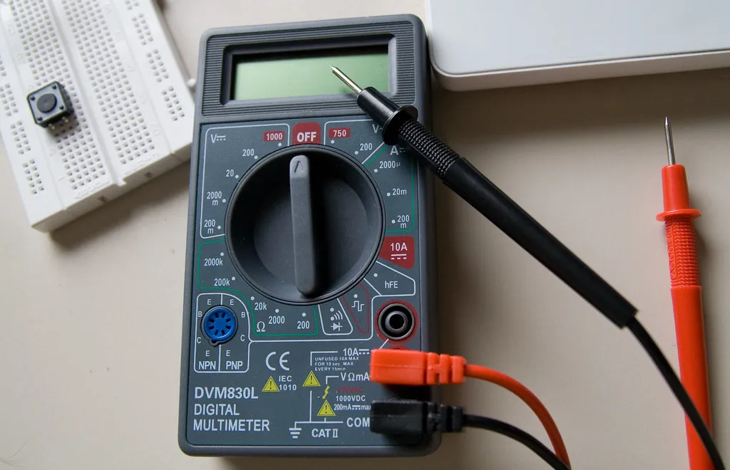 Digital multimeter with red and black test probes