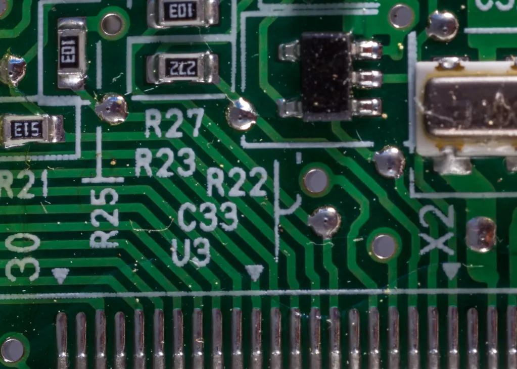 Close-up of soldered joints and component markings on a circuit board