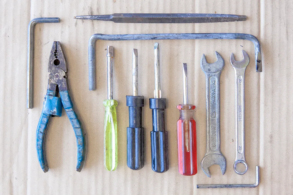 Pliers, screwdrivers and spanners laid out in a row